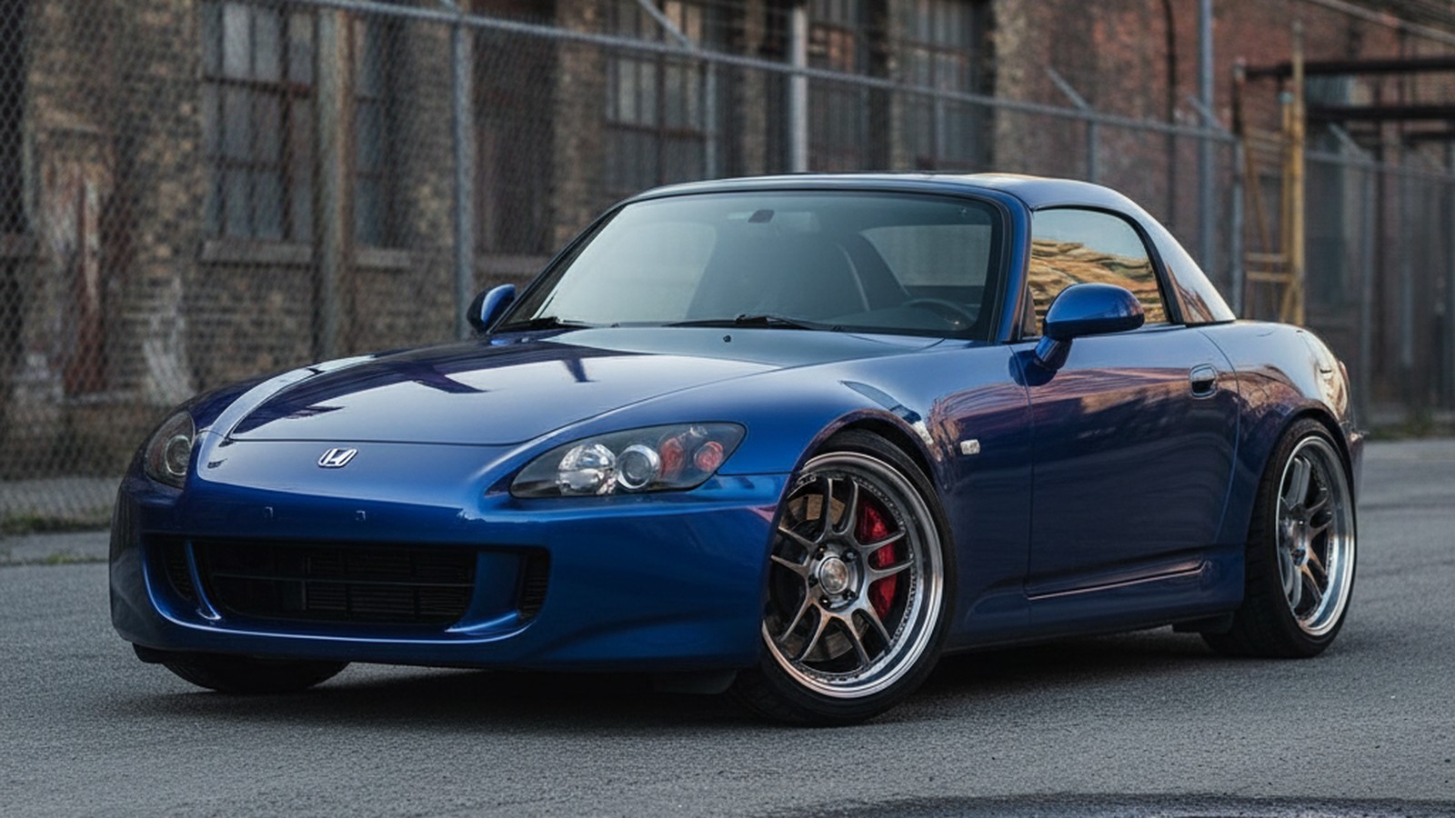 Honda S2000 on custom aftermarket wheels, front three-quarter view