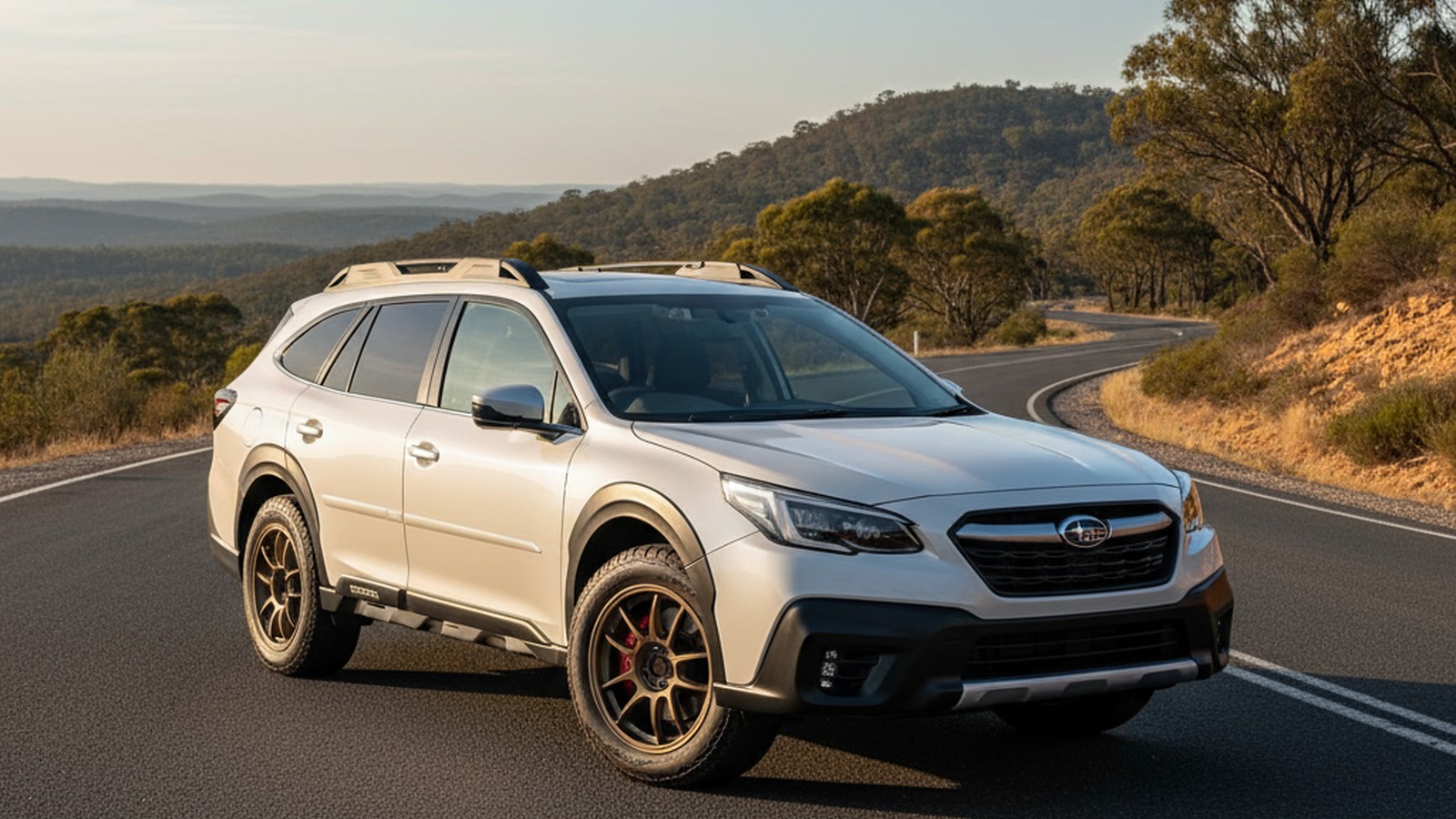 Subaru Outback XT on custom aftermarket wheels, front three-quarter view